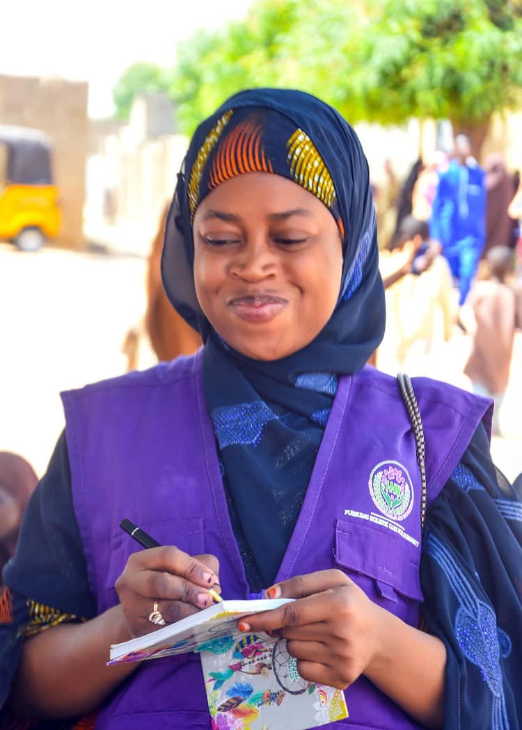 HHAI field officer documenting a community outreach session